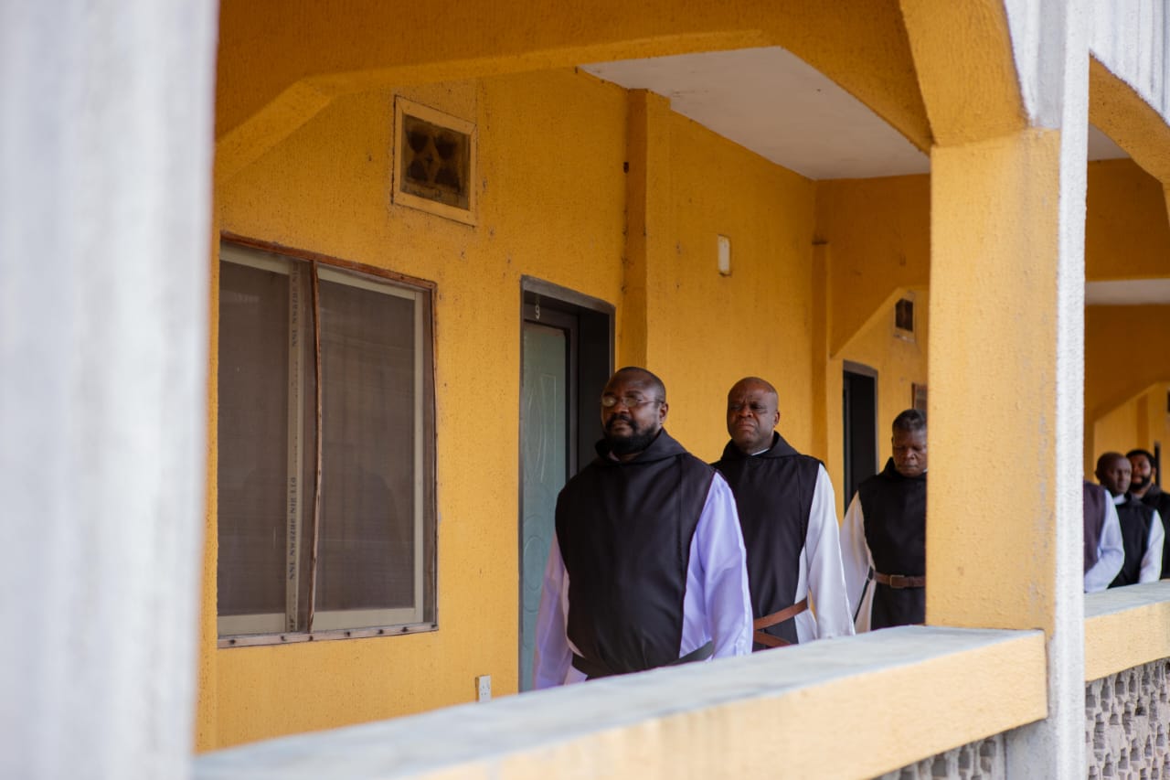 Monks processing to the refectory after prayer