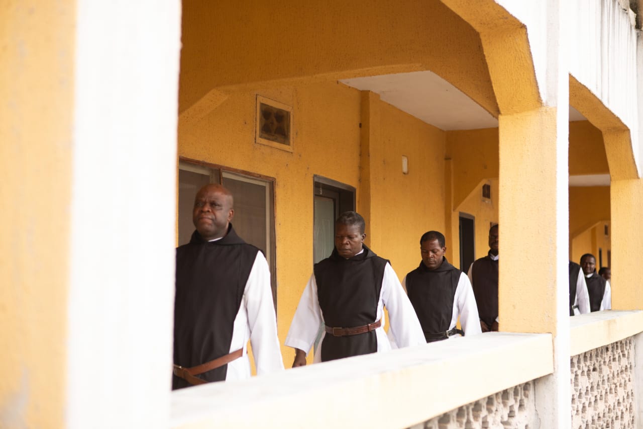Monks processing to the refectory after prayer